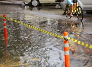 Passenger Switches Roles With Elderly Pedicab Driver Amid Flood
